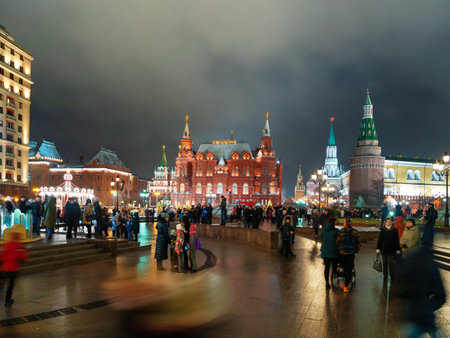 MOSCOW, RUSSIA - January 03, 2018. Locals and tourists walking near State Historical Museum. Night view on landmarks near Kremlin.のeditorial素材