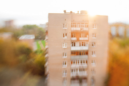 Sunset over Odintsovo town, shooted with Lens Baby Sweet 35mm. Sun rays behind building. Moscow region. Russia.の写真素材