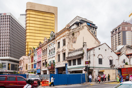 KUALA LUMPUR, MALAYSIA - February 01, 2013. Leboh Pasar Besar, where modern buildings mingled with old shabby ones. Many signs and advertisements on the walls.のeditorial素材