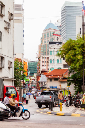 KUALA LUMPUR, MALAYSIA - February 01, 2013. Streets of Kuala Lumpur, where modern buildings mingled with old shabby ones. Many signs and advertisements on the walls.のeditorial素材