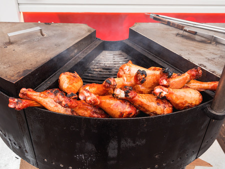 Grilled chicken legs. Outdoor barbecue. Fast food BBQ.の写真素材