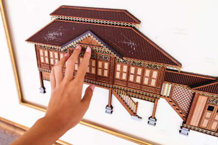 KUALA LUMPUR, MALAYSIA - February 04, 2013. Flat architectural model of chinese house. A sample of wood cutting that tourists can touch in City Gallery.のeditorial素材