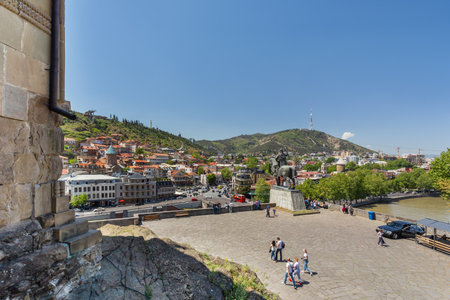 TBILISI, GEORGIA - May 01, 2017. Panorama view on monument to Vakhtang I Gorgasali near Metekhi Church of the Dormition of the virgin.のeditorial素材