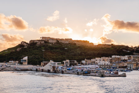 GOZO, MALTA - February 20, 2010. Port of Mgarr on the small island of Gozo, Malta. Sunset, panorama view.のeditorial素材