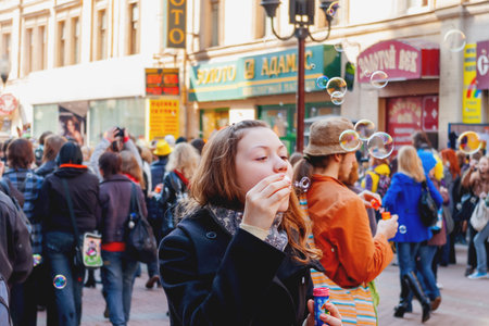 MOSCOW, RUSSIA - April 12, 2009. Dreamflash, street festival of soap bubbles. People dressed in funny costumes walking on the Arbat street. Colorful fair.のeditorial素材