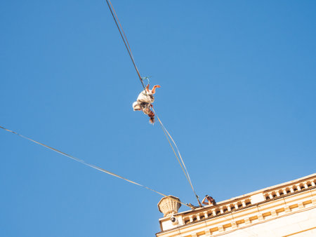 MOSCOW, RUSSIA - September 07, 2019. Funambulist over Tverskaya street. Street festival and different leisure activities on Moscow Day celebration.のeditorial素材