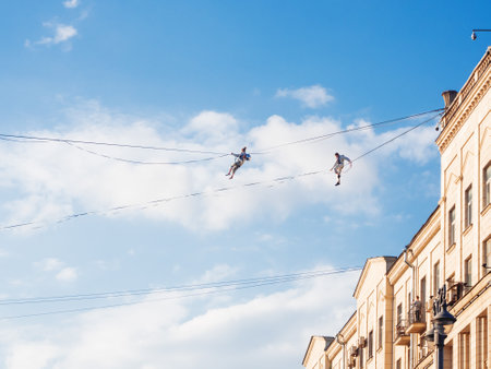 MOSCOW, RUSSIA - September 07, 2019. Two funambulists over Tverskaya street. Street festival and different leisure activities on Moscow Day celebration.のeditorial素材