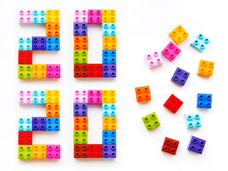 New 2020 Year. Colorful constructor blocks. Toy bricks lyingwithout order. Multicolored toy details....