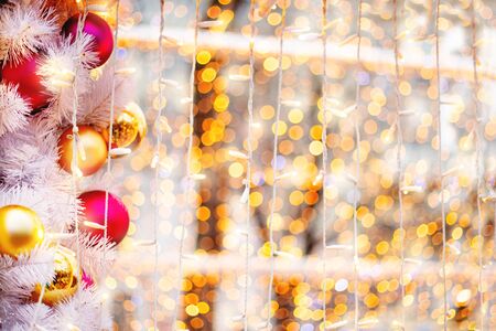 Christmas and New Year outdoors decorations - light bulbs and balls. Festive background.の写真素材