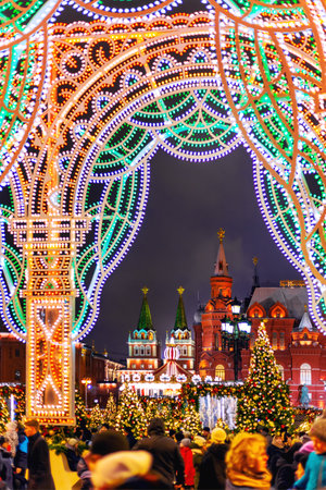 MOSCOW, RUSSIA - January 03, 2018. View of Historical museum and Kremlin through decorative arch with light bulbs.のeditorial素材