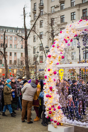 MOSCOW, RUSSIA - January 3, 2018. People are walking and taking photos of outdoors decoration for New Year and Christmas celebration.のeditorial素材