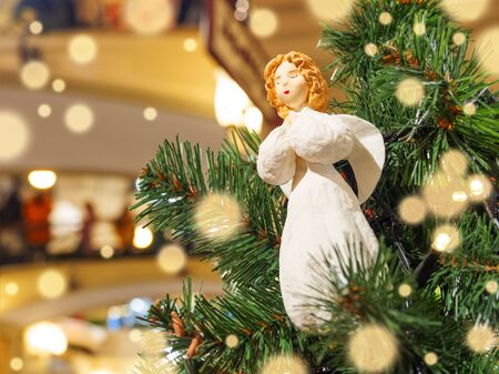 Little angel, vintage toy for Christmas tree. Traditional decoration for New Year celebration.の写真素材