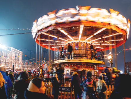 MOSCOW, RUSSIA - December 10, 2017. Red Square decorated for New Year and Christmas fair. Colorful carousel decorated with light bulbs.のeditorial素材
