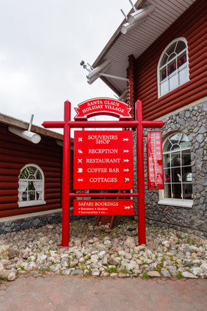 ROVANIEMI, FINLAND - July 20, 2017. Sign with pointers near souvenir shop and museum in Santa Claus village. Arctic circle.のeditorial素材