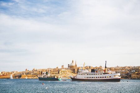 St.Paul cathedral and other historical buildings.Sunset panorama view of Valletta, Malta.の写真素材
