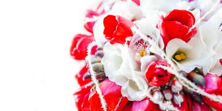 Bridal bouquet on sunlight. Traditional floral composition with bright red tulips. Background with copy space.の写真素材