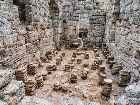 Ruins of large bath in ancient Phaselis city. Famous architectural landmark, Kemer district, Antalya province. Turkey.の写真素材
