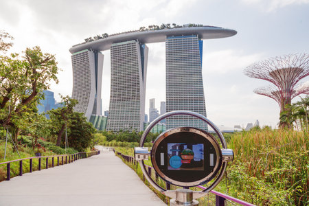 SINGAPORE, SINGAPORE - January 17, 2013. Panorama view on Marina Bay Sands hotel from Gardens by the Bay. Famous modern architectural landmark in Asia.のeditorial素材