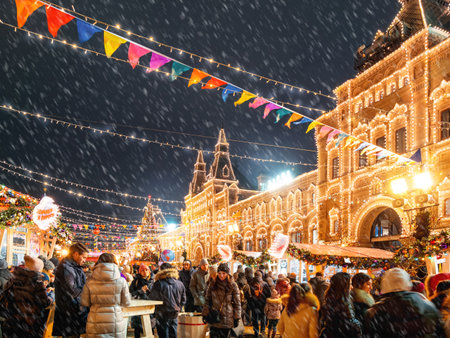 Moscow, Russia - December 21, 2019. Red Square decorated for New Year and Christmas fair. Crowd of people near GUM (Main Department Store) building with light bulbs.のeditorial素材