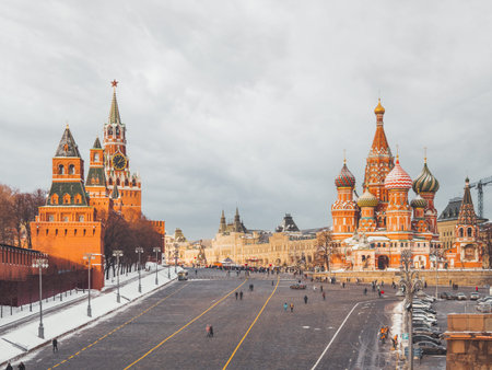 Tourists near St. Basil's Cathedral on Red square. Traditional Christmas fair near Kremlin. Moscow,...