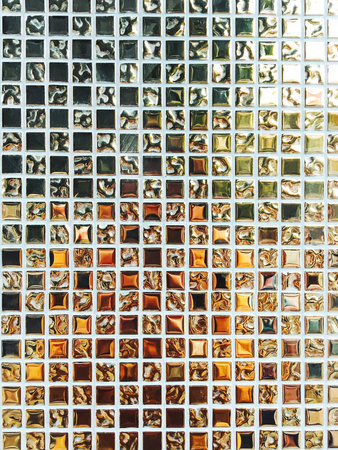 Colorful background made of square mirror tiles. Mosaic pieces with smooth and swirled texture....