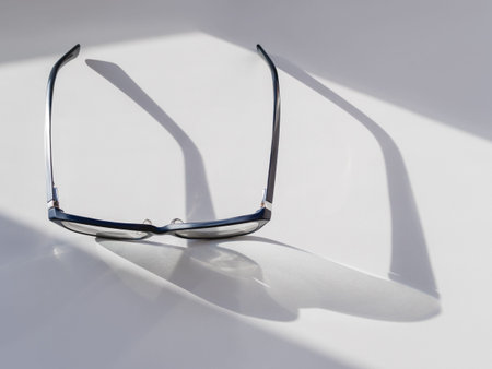 Top view of eyeglasses on white background. Comfortable life with poor eyesight. Ophthalmology....
