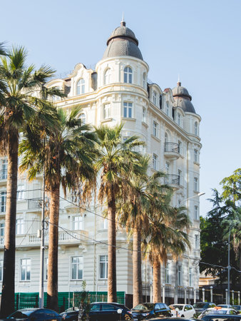 SOCHI, RUSSIA - May 27, 2021. Facade of apartment hotel Matisse. Beautiful building with palm trees alley at sunny day.のeditorial素材