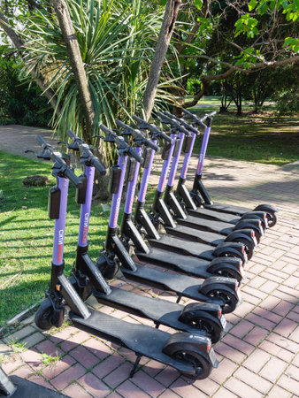 SOCHI, RUSSIA - May 27, 2021. Kick scooters for rent in urban park. Eco-friendly and comfortable urban transport for tourists and locals.のeditorial素材