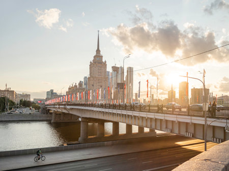 MOSCOW, RUSSIA - August 22, 2021. View on Moscow-river embankment, Novoarbatsky bridge and hotel Ukraine. Famous skyscraper at summer sunset.のeditorial素材