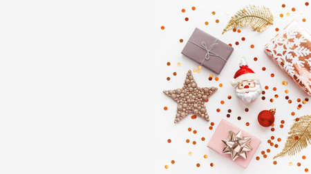 Christmas and New Year background with decorations. Santa Claus, golden feathers, presents and stars...