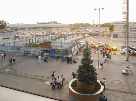 MOSCOW, RUSSIA - June 28, 2021. Top view on moving people near Domodedovo airport building. Long exposure.のeditorial素材