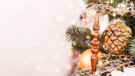 Christmas tree with shiny icicle and decorative pine cone. Fir tree decorated with light bulbs for...
