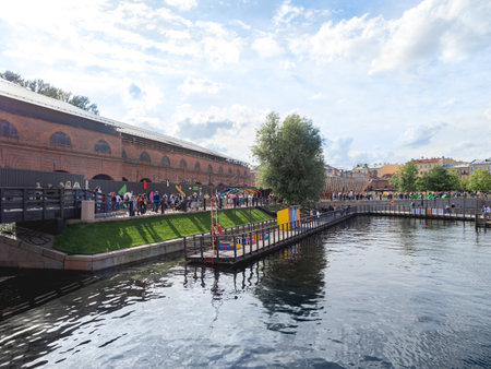 SAINT-PETERSBURG, RUSSIA - August 15, 2021. Panorama of New Holland island. Urban public park with playgrounds, garden and old buildings.のeditorial素材