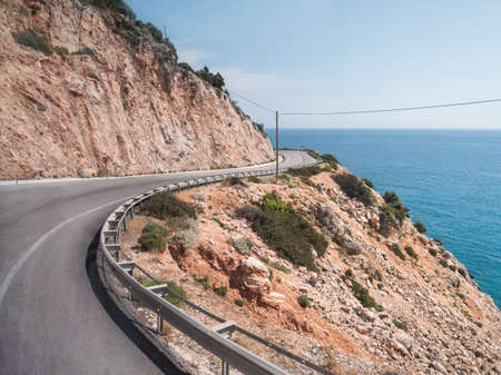 Mountain serpentine road along Mediterranean sea. Demre Finike Yolu (road). Turkey.の写真素材