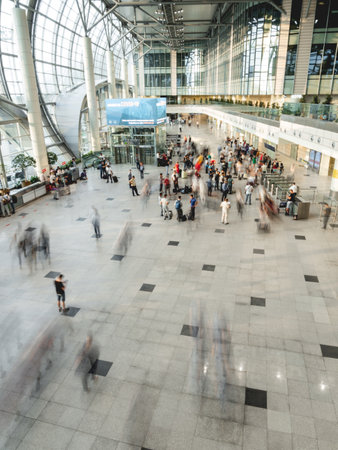 MOSCOW, RUSSIA - June 28, 2021. Moving people on first floor at Domodedovo airport hall. Long exposure.のeditorial素材