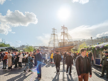 MOSCOW, RUSSIA - May 29, 2022. People walk among street shops on Fish Week festival. Food fair with stores and outdoor decorations on Manezhnaya square.のeditorial素材