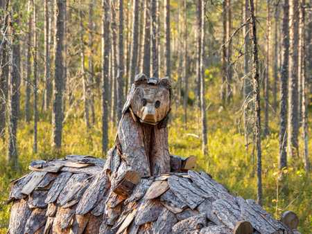 KARGOPOL, RUSSIA - September 10, 2018. Wooden statue of mother bear with little bear in park named Path of anthills.のeditorial素材