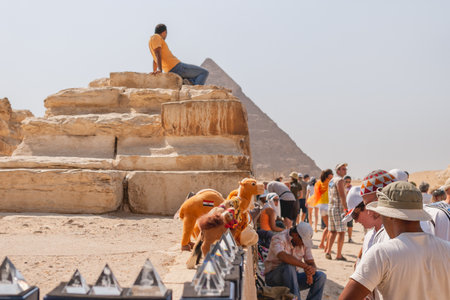 GIZA, EGYPT - September 11, 2008. Trade trays and small shops with souvenirs for near the Big pyramid. Tourists buy different statues and toy camels.のeditorial素材