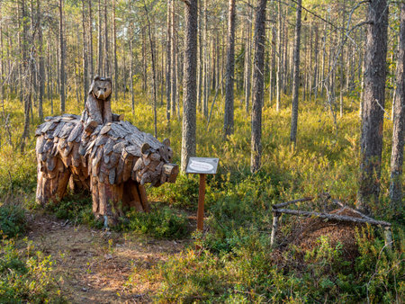 KARGOPOL, RUSSIA - September 10, 2018. Wooden statue of mother bear with little bear in park named Path of anthills.のeditorial素材