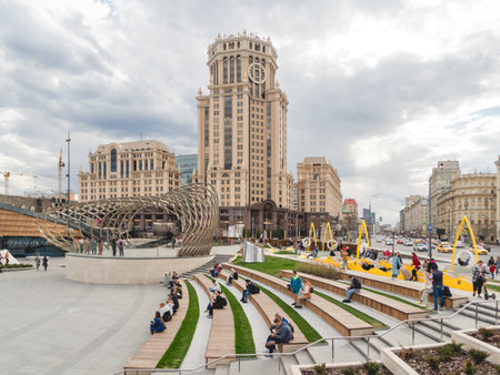MOSCOW, RUSSIA - May 01, 2022. Local people and tourists walk on square near Paveletsky railway. Modern urban architecture.のeditorial素材