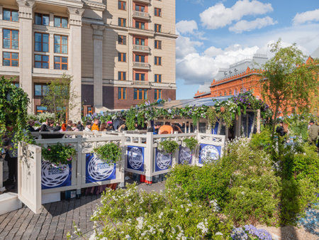 MOSCOW, RUSSIA - May 29, 2022. People walk among street shops on Fish Week festival. Food fair with stores and outdoor decorations.のeditorial素材