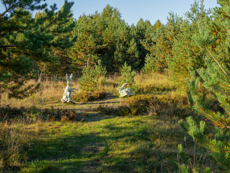 KARGOPOL, RUSSIA - September 10, 2018. Wooden statues of rabbits in park named Path of anthills.のeditorial素材