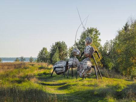 KARGOPOL, RUSSIA - September 10, 2018. Wooden statues of ants in park named Path of anthills.のeditorial素材