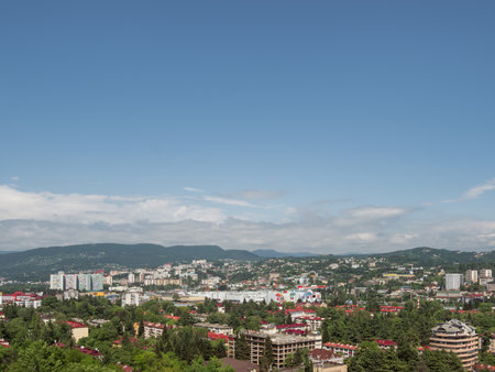 SOCHI, RUSSIA - May 27, 2021. Panorama view of central district of Sochi. Apartment buildings and mountains on the horizon.のeditorial素材