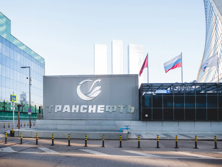 MOSCOW, RUSSIA - October 16, 2022. Metal letters of name and logo on main building of central office of Transneft oil company. National Russian and Moscow flags at Moscow International Business Center.のeditorial素材
