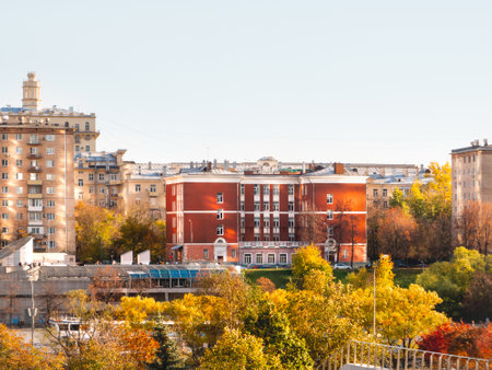 MOSCOW, RUSSIA - October 16, 2022. View on school 56 at Kutuzovsky prospect at sunny autumn day. Sunbeams from water of Moscow-river on old buildings.のeditorial素材