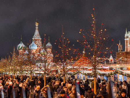 MOSCOW, RUSSIA - December 19, 2021. Saint Basil Cathedral over light bulbs of traditional Christmas fair on Red square. People celebrate New Year.のeditorial素材