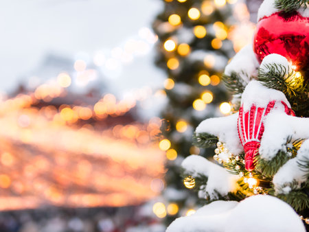 Christmas tree with colorful outdoor decorations. Fir tree decorated with light bulbs for New Year celebration. Moscow, Russia.の写真素材