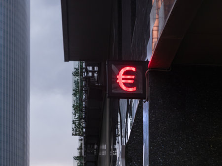Symbol of Euro, currency of European union on outdoor electric screen. Currency exchange office or bank branch in downtown.の写真素材
