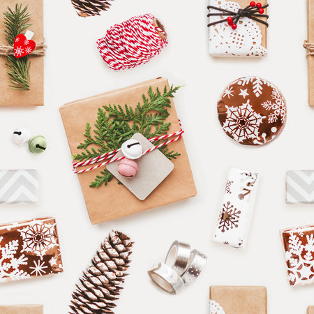 Photo seamless pattern with Christmas presents and New Year decorations. Top view on gift boxes in...